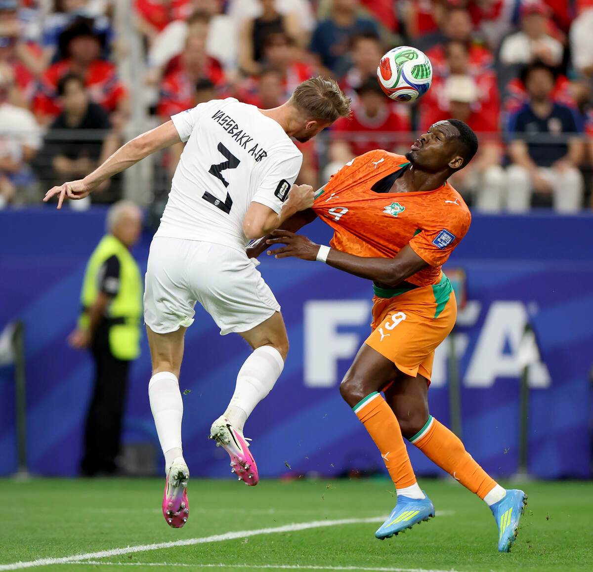 Norway defender Kristoffer Ajer (3) and Ivory Coast forward Ange-Yoan Bonny compete for possession during the 2026 FIFA World Cup knockout match on Tuesday, June 30, 2026, at Dallas Stadium in Arlington.